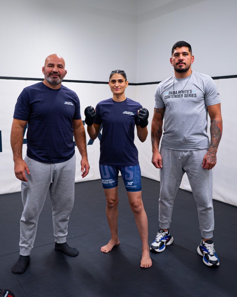 Aline Pereira wearing gloves next to her brother Alex Poatan Pereira before her Contender Series fight